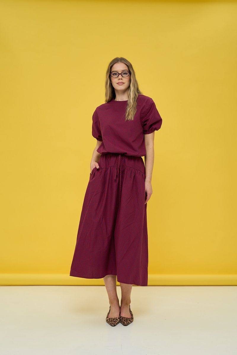 Women's dark blue suit with a skirt in red check
