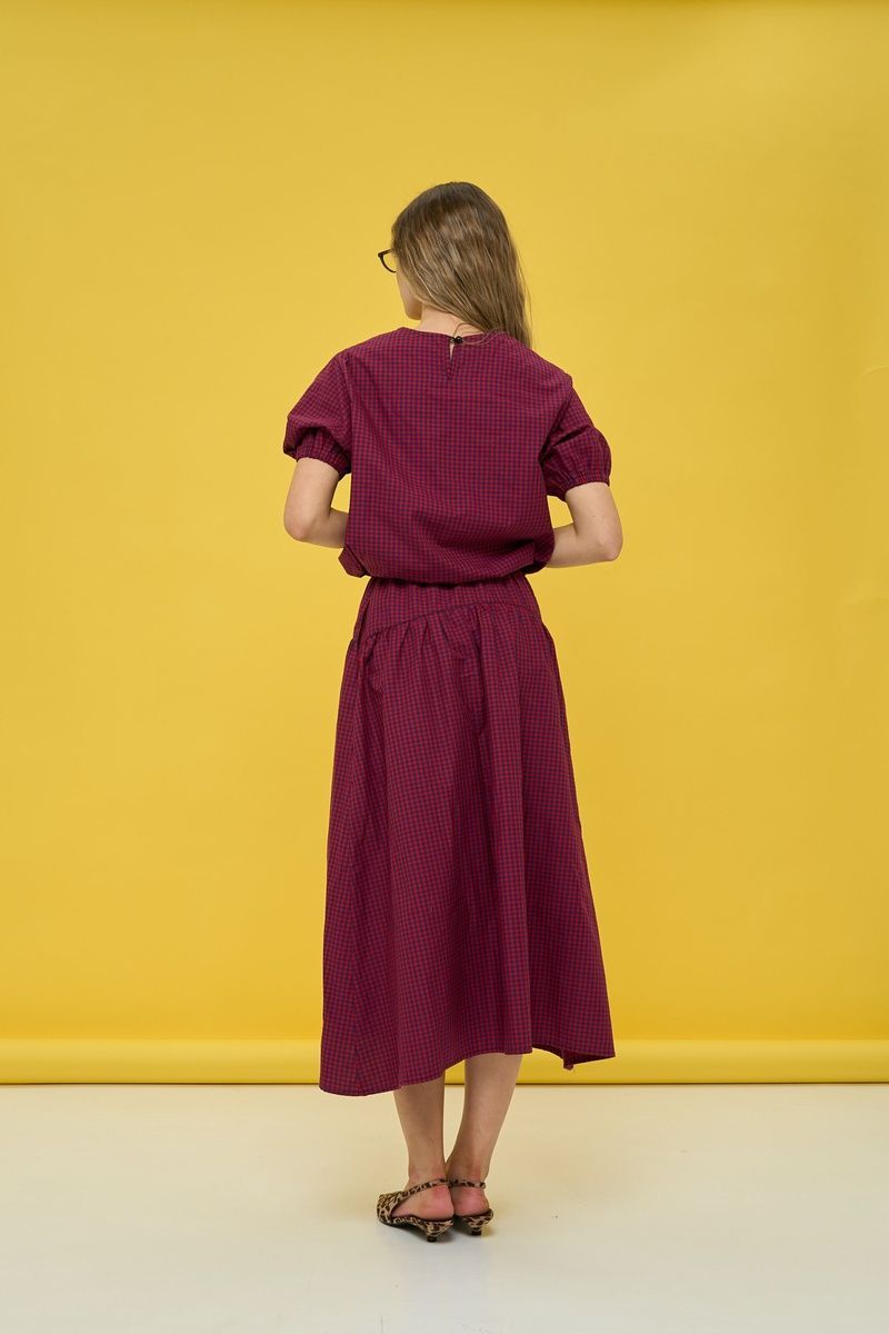 Women's dark blue suit with a skirt in red check