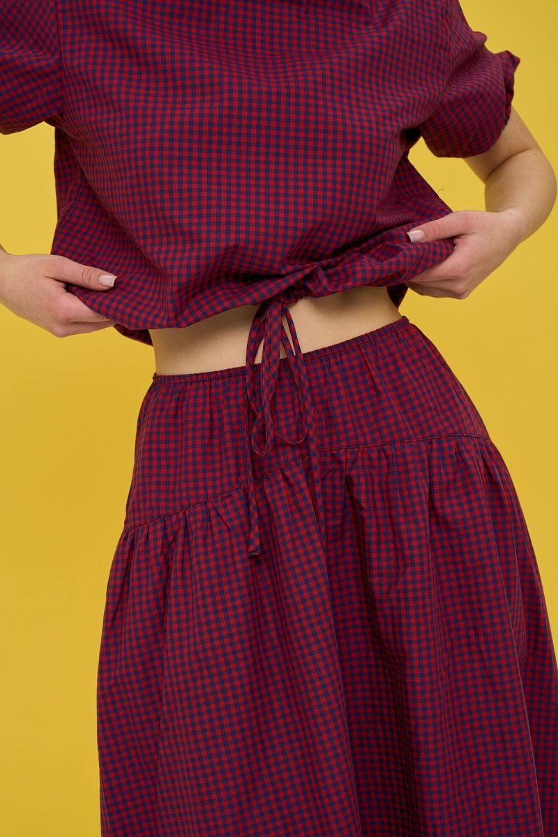 Women's dark blue suit with a skirt in red check