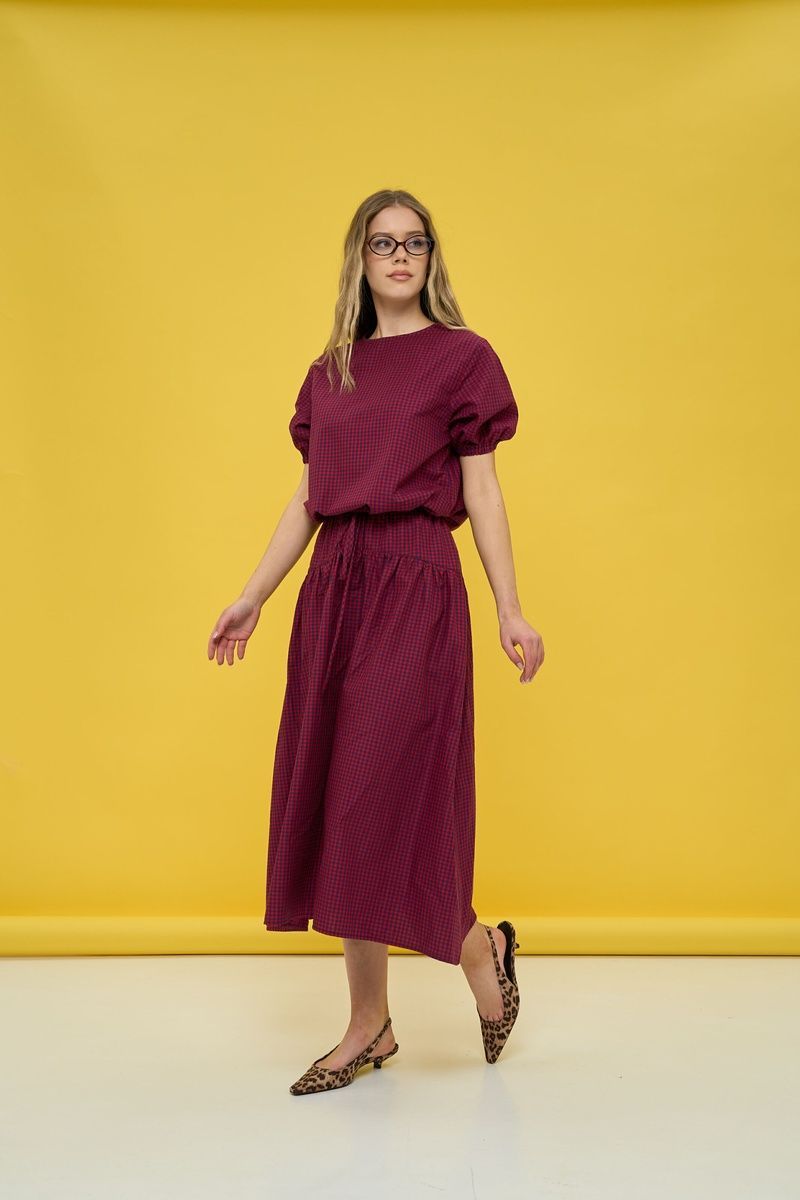 Women's dark blue suit with a skirt in red check