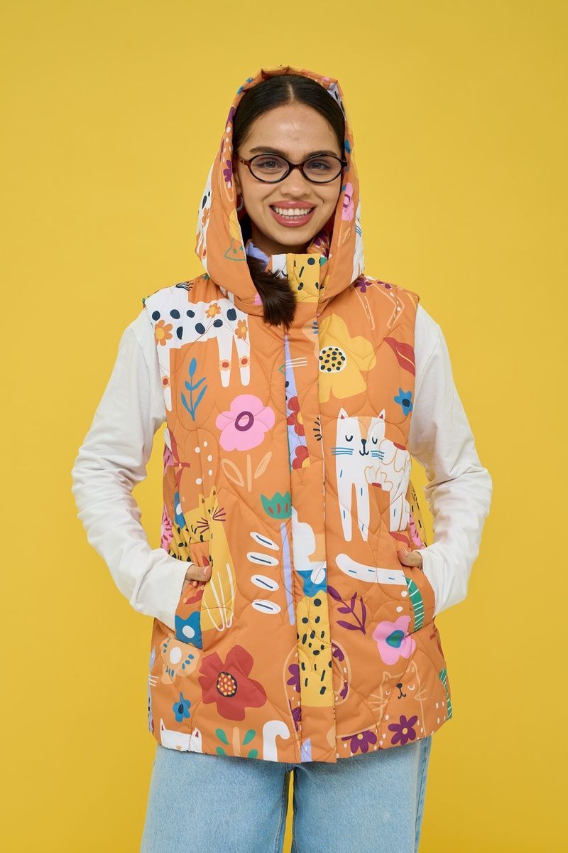 Women's insulated orange vest with an 'Ethnic Cats' print