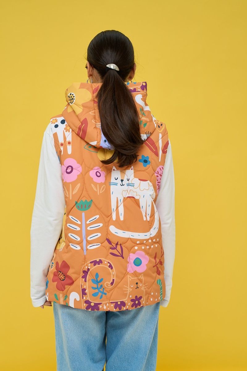 Women's insulated orange vest with an 'Ethnic Cats' print