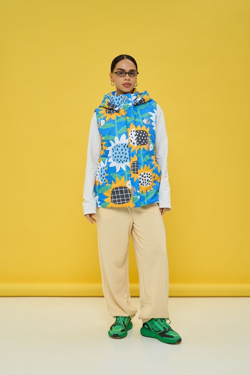 Women's insulated blue vest with a 'Sunflowers' print