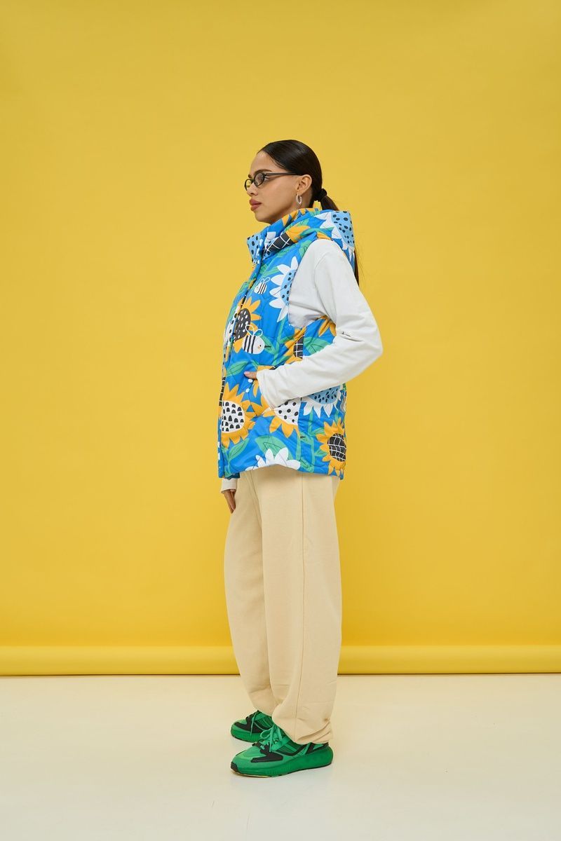Women's insulated blue vest with a 'Sunflowers' print